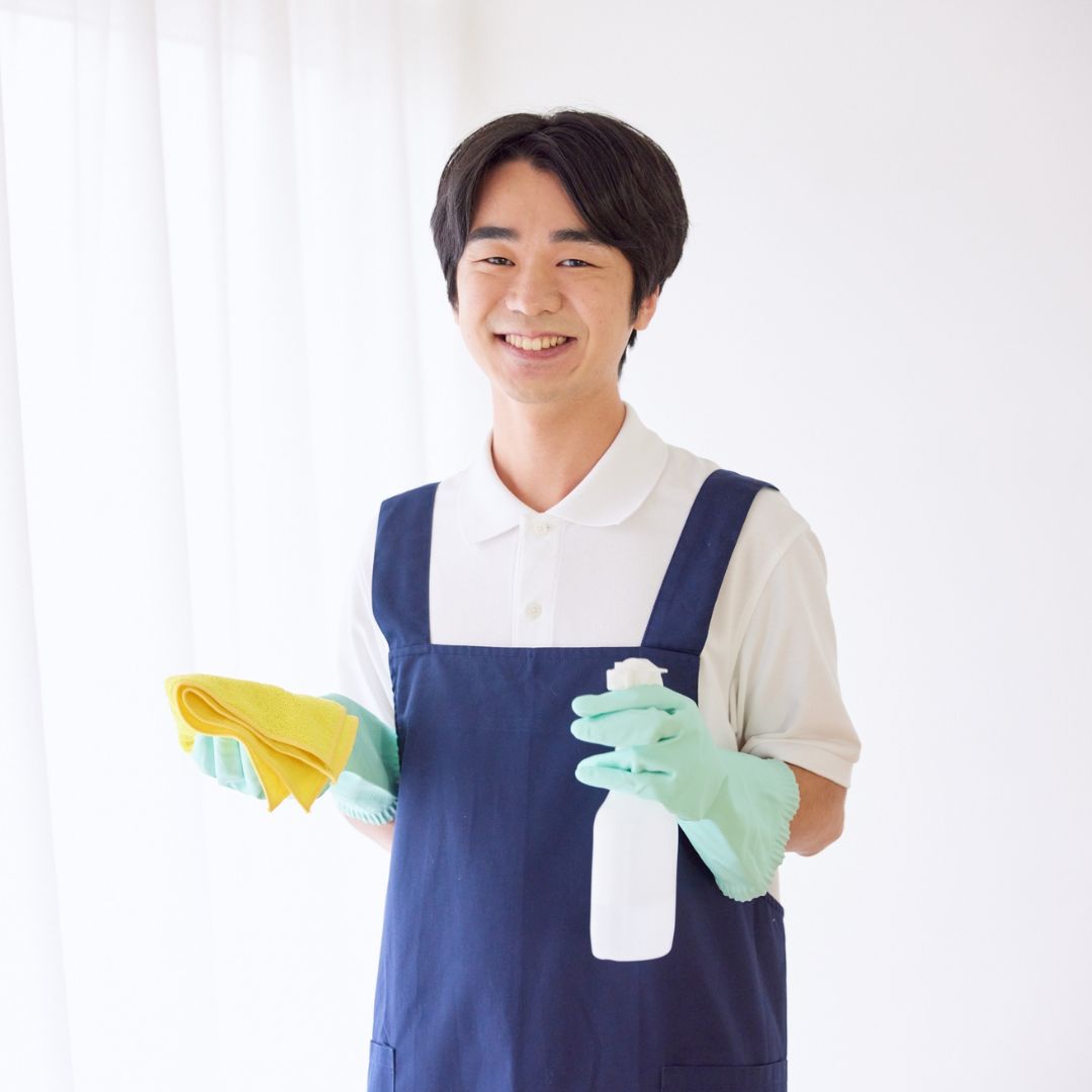 A person holding cleaner