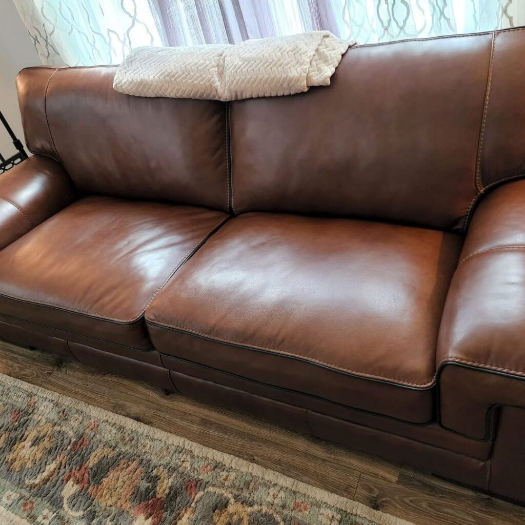repaired leather couch in a residential living room